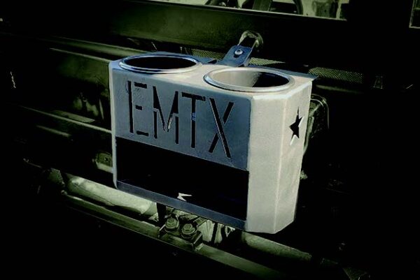 A metal trash receptacle with the word emtx on it.